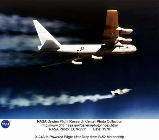 An X-24A
 lights its rocket engine and begins its powered flight after being drop launched from its B-52 mothership in 1970. The X-24A was flown 28 times, and validated the concept that a Space Shuttle could be landed unpowered. The X-24B was built around the fuselage of the original X-24A, converting the bulbous shape into a 'flying flatiron' with a rounded top, flat bottom, and double delta platform that ended in a pointed nose. It demonstrated that accurate unpowered reentry vehicle landings were operationally feasible. Photo: NASA / SL