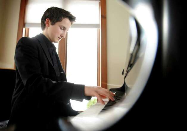 Sixteenyearold Alexander Beyer performs on the grand piano in his 