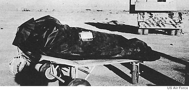 FILE--This photo is from the Air Force's "The Roswell Report," released Tuesday, June 24, 1997, which discusses the UFO incident in Roswell, N.M. in 1947. On balloon flights, test dummies were used and placed in insulation bags to protect temperature sensitive equipment. These bags may have been described by at least one witness as "body bags" used to recover alien victims from the crash of a flying saucer. The 231-page report, released on the eve of the 50th anniversary of the Roswell, N.M., UFO incident, is meant to close to book on longstanding rumors that the Air Force recovered a flying saucer and extraterrestrial bodies near Roswell. (AP Photo/Air Force, File) BLACK AND WHITE ONLY / DATE AND PLACE OF PHOTO UNKNOWN Ran on: 08-16-2004