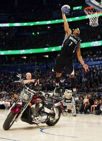 Minnesota Timberwolves' Derrick Williams jumps over a motorcycle during the NBA basketball All-Star Slam Dunk Contest in Orlando, Fla., Saturday, Feb. 25, 2012. (AP Photo/Lynne Sladky) (AP) / SA