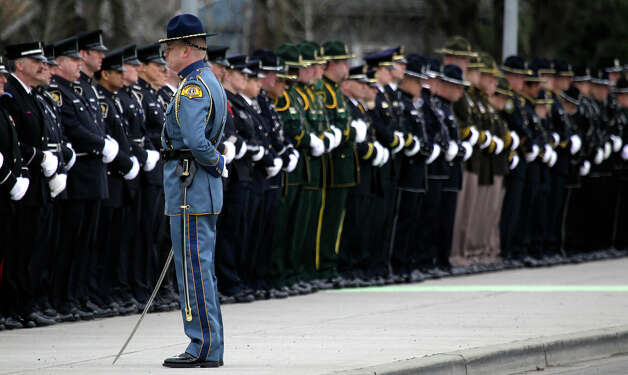 Washington State Patrol honor guard commander Zach Elmore stands in front of