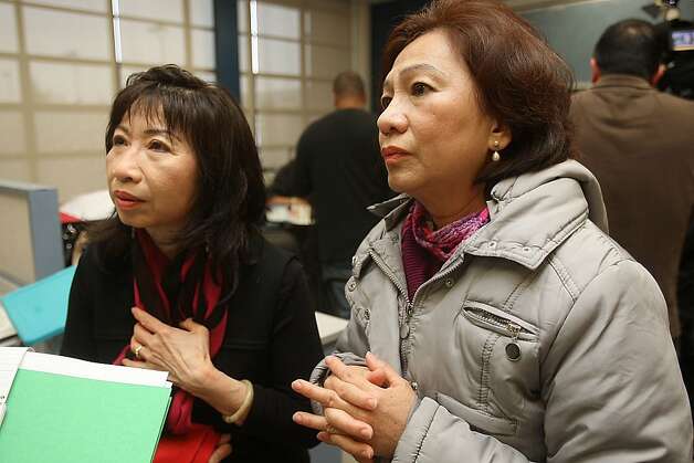 Licensed nail salon worker Hue Nguyen (right) talks about some of the