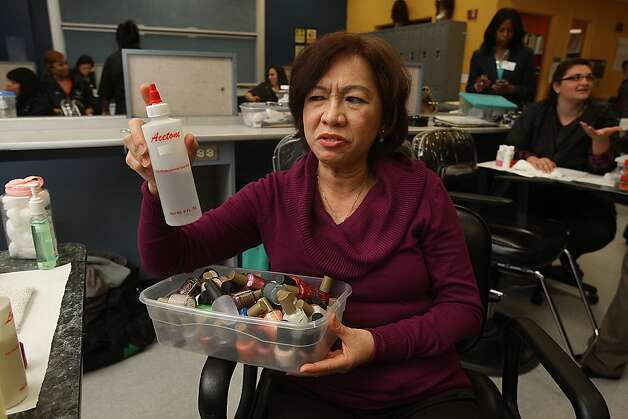 Licensed nail salon worker Hue Nguyen talks about some of the products she