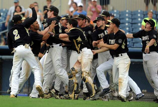 Trumbull players celebrate winning Saturday's FCIAC baseball championship game against Greenwich at the Ballpark at Harbor Yard in Bridgeport on May 26, 2012. Photo: Lindsay Niegelberg / Stamford Advocate