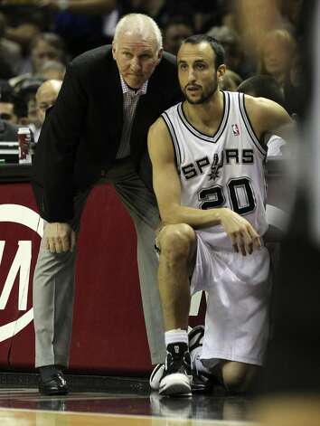 San Antonio Spurs coach Gregg Popovich stands near San Antonio Spurs' Manu Ginobili (20) during the first half of game two of the NBA Western Conference Finals in San Antonio, Texas on Tuesday, May 29, 2012. Kin Man Hui/Express-News (Kin Man Hui / San Antonio Express-News) / SA