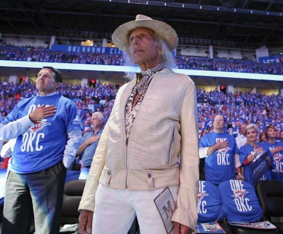 James Goldstein, standing during the national anthem before Game 3 of the Western Conference Finals on May 31, 2012, has been a courtside figure in arenas for decades. He’s beloved by the NBA world because of his love for the game.  (Edward A. Ornelas / San Antonio Express-News)