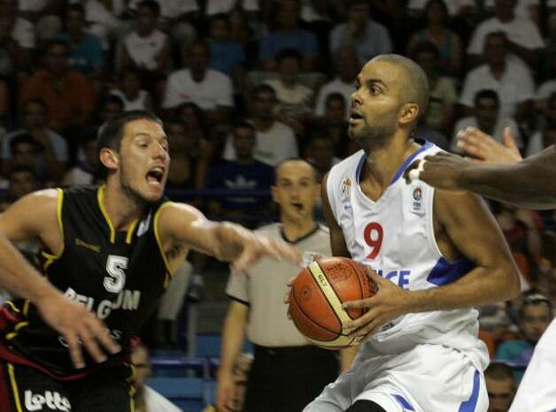 French NBA player Tony Parker, right, and unidentified Belgian player seen, during the Euro 2009 basketball qualifying round France against Belgium, in Pau, southwestern France, Sunday, Aug. 30, 2009. France won 92 to 54 to qualify. (Fred Scheiber / Associated Press) / SA