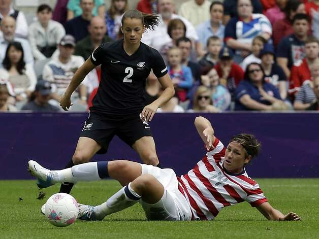 Abby Wambach protects her turf while battling New Zealand's Ria Percival for the ball in the Americans' 2-0 win. Photo: Sergey Ponomarev, Associated Press / SF