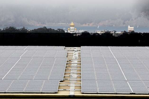Solar panels cover the roof of San Francisco's Sunset Reservoir. The Board of Supervisors is set to consider legislation Tuesday that would allocate $19.5 million to establish the CleanPowerSF program. Photo: Michael Macor, The Chronicle / SF