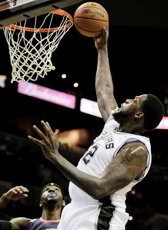 The Spurs' Eddy Curry shoots during the first half of an NBA preseason basketball game against the Atlanta Hawks, Wednesday, Oct. 10, 2012, in San Antonio. Photo: Darren Abate, Associated Press / FR115 AP