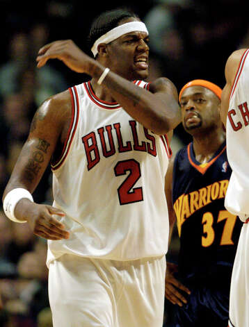The Chicago Bulls' Eddy Curry (2) reacts after sinking a basket and drawing a foul as the Golden State Warriors' Nick Van Exel (37) looks on during the first quarter Saturday, Feb. 28, 2004 in Chicago. The Bulls won the game 87-81 in overtime. (Jeff Roberson / Associated Press) Photo: JEFF ROBERSON, AP / AP