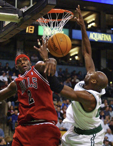Chicago Bulls center Eddy Curry (left) knock the ball from the hands of Boston Celtics center Vin Baker, right, on a block during the first quarter in Boston, Wednesday, Nov. 12, 2003. (Charles Krupa / Associated Press) Photo: CHARLES KRUPA, AP / AP