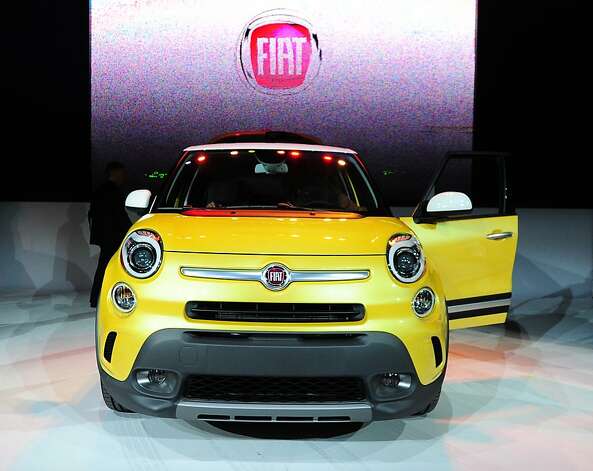 The Fiat 500L Trekking is displayed at its world premiere at the Los Angeles Auto show  in Los Angeles, California on media preview day, November 28, 2012. The 500L is a five-door sub-compact minivan with seating for five and looks that borrow styling cues from the smaller 500 city car.  The LA Auto Show will open to the public on November 30 and runs through December 9. Photo: Robyn Beck, AFP/Getty Images / SF