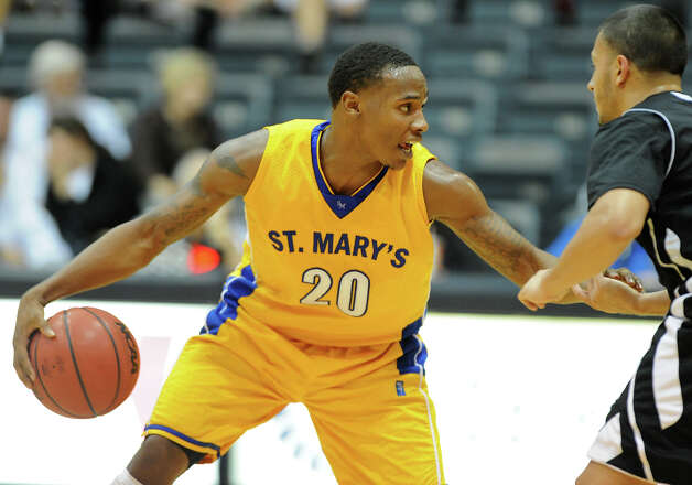 St. Mary's Mark Simmons (20) brings the ball up the court during a Men's NCAA Division II basketball game between the Incarnate Word University Cardinals and the St. Mary's University Rattlers at Bill Greehey Arena, Tuesday, December 4, 2012. Photo: John Albright, For The Express-News / San Antonio Express-News