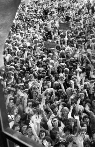 Fans waited outside the Seattle Center Coliseum before The Beatles Aug. 21, 1964 concert. Legendary disc jockey Pat O'Day said it was the first concert of its kind at what's now KeyArea. (Stuart B. Hertz/seattlepi.com file)