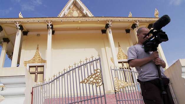 Michael Siv, who grew up in S.F., works on his documentary outside a temple in Cambodia.