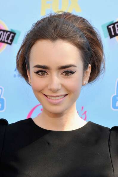 Actress Lily Collins attends the 2013 Teen Choice Awards at Gibson Amphitheatre on August 11, 2013 i