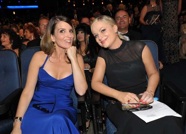 Tina Fey and Amy Poehler in the audience at the 65th Primetime Emmy Awards at Nokia Theatre on Sunday Sept. 22, 2013, in Los Angeles. (Photo by John Shearer/Invision for Academy of Television Arts & Sciences/AP Images)