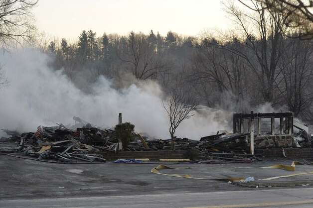 Hot spots are still evident at the site of Tuesday night's fire at the Villa Valenti in North Greenbush. (Skip Dickstein / Times Union)