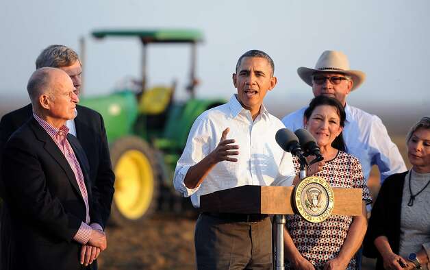President Obama addresses the seriousness of the drought as he speaks to the media with Gov. Jerry Brown (left) and farmers Joe and Maria Del Bosque in Los Banos (Merced County). Photo: Wally Skalij, Associated Press