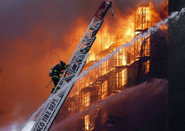 San Francisco firefighters battle a five alarm fire in the Mission Bay area of San Francisco, Calif. on Tuesday March 11, 2014. Photo: Michael Macor, The Chronicle