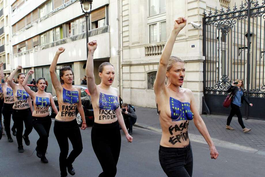 Topless feminist campaigners protest against real 