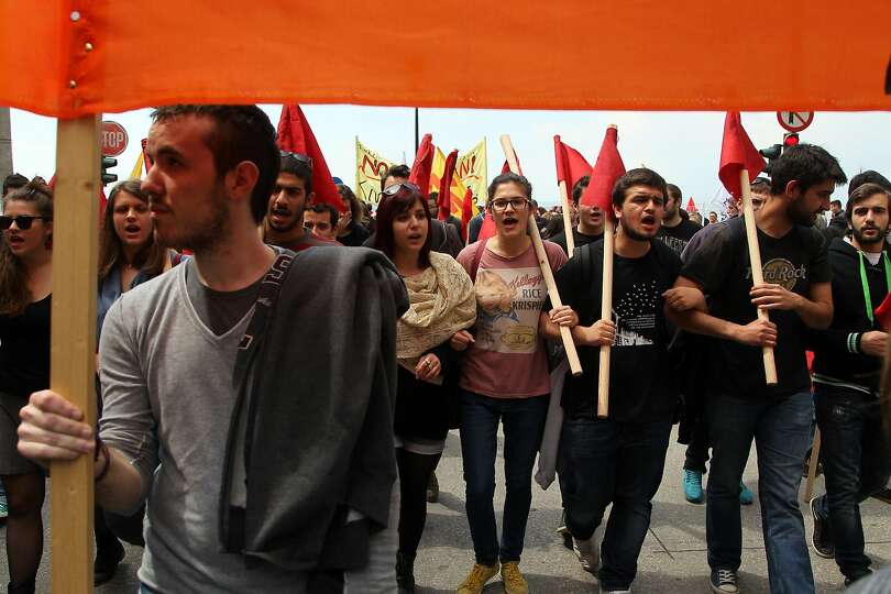 Demonstrators march in May Day protests in the Northern Greek city of Thessaloniki on Thursday, May 