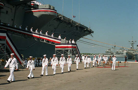 Ranks of enlisted crew members of Saratoga file off the ship for the last time at the end of the decommissioning ceremony. The historic aircraft carrier arrived in Brownsville on Friday and will be dismantled. Photo: Wikimedia