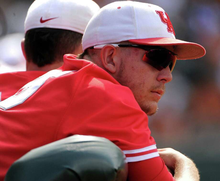 Houston starting pitcher Jake Lemoine watches from the dugout after being pulled from the game during - 920x920