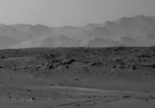 UFO Light on Mars?The light can be seen in the upper right corner of the frame, above a line of Martian hills.The light isn't the first mysterious item spotted by the Mars rover. Here's what else space spotters have seen... Photo: NASA Rover Image