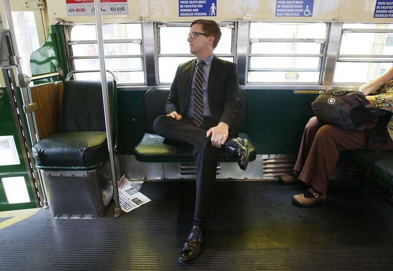 San Francisco Cultural Affairs Director Thomas DeCaigny rides a Muni streetcar while on his way to a meeting at City Hall on July 01, 2014 in San Francisco, CA.