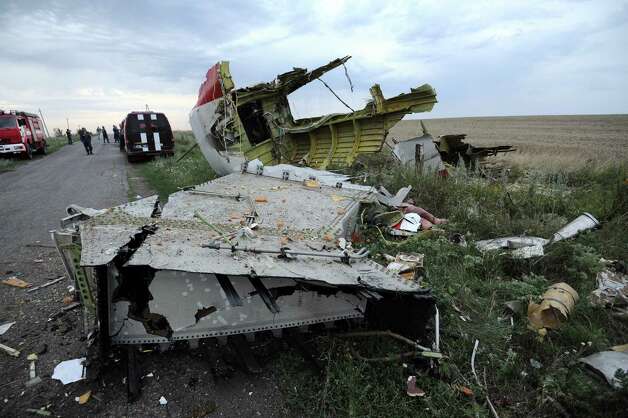 A picture taken on July 17, 2014 shows the wreckages of the malaysian airliner carrying 295 people from Amsterdam to Kuala Lumpur after it crashed, near the town of Shaktarsk, in rebel-held east Ukraine. Pro-Russian rebels fighting central Kiev authorities claimed on Thursday that the Malaysian airline that crashed in Ukraine had been shot down by a Ukrainian jet. The head of Ukraine's air traffic control agency said Thursday that the crew of the Malaysia Airlines jet that crashed in the separatist east had reported no problems during flight. AFP PHOTO/DOMINIQUE FAGET Photo: DOMINIQUE FAGET, AFP / AFP