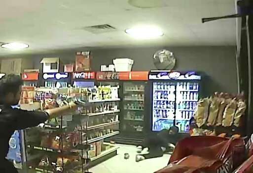 A gunman demanded money at a family-owned convenience store on  Scranton Street in southeast Houston Friday night, and an employee (left) shot  him.