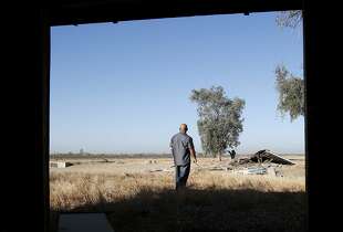 Tribal member Alex Lewis walks through the property owned by his tribe where he hopes a casino will be built Wednesday September 17, 2014. Proposition 48 on the November ballot would approve a state compact allowing the North Fork tribe of Mono Indians to build a large casino on Highway 99 alongside the town of Madera, Calif.