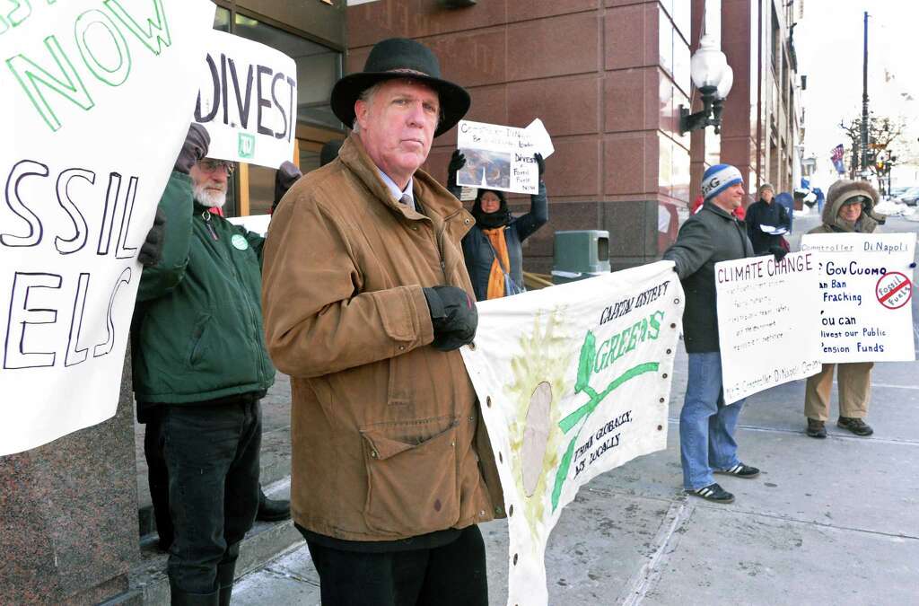 Mark Dunlea, left, of NYS Green party education and legal fund during a rally to urge NYS to divest all pension funds from fossil fuels outside the the NYS Comptrollers office Friday Feb. 13, 2015, in Albany, NY. (John Carl D'Annibale / Times Union) Photo: John Carl D'Annibale / 00030573A