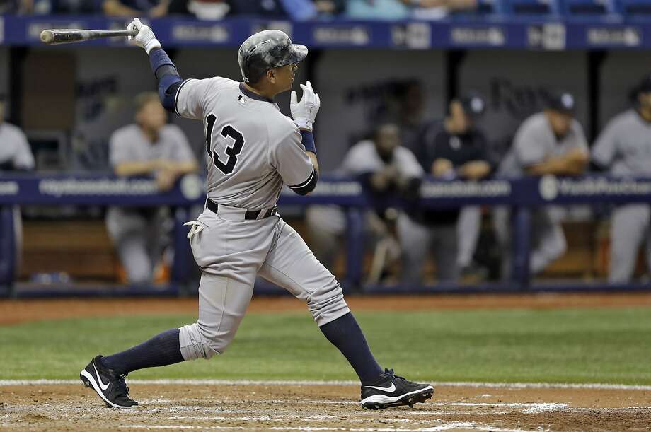 New York Yankees' Alex Rodriguez follows the flight of his two-run home run off Tampa Bay Rays relief pitcher Ernesto Frieri during the sixth inning of a baseball game Friday, April 17, 2015, in St. Petersburg, Fla. (AP Photo/Chris O'Meara) Photo: Chris O'Meara, Associated Press