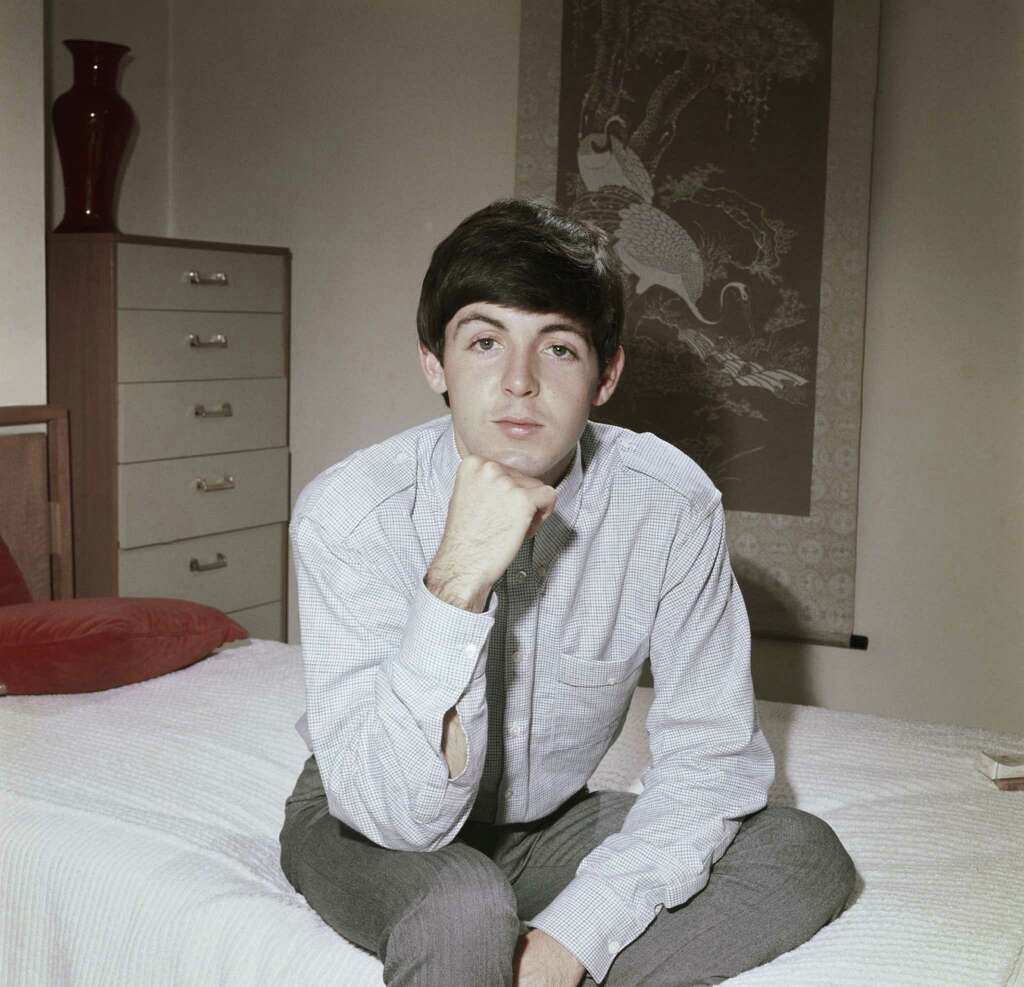 LONDON - CIRCA 1964:  Bassist Paul McCartney of the rock band "The Beatles" poses for a portrait sitting on a bed in circa 1964 in London, England.  (Photo by Michael Ochs Archives/Getty Images) Photo: Michael Ochs Archives, Getty Images  / Michael Ochs Archives