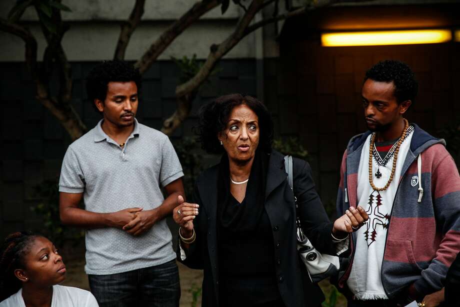 Rebecca Lakew speaks at a candlelight vigil for Yonas Alehegne, an Ethiopian immigrant who was shot and killed by an Oakland police officer in August, in Oakland, Calif., on Sunday, September 13, 2015.  Lakew was working at the Ethiopian Community Center when Alehegne came in for help.  Alhegne was homeless at the time he was killed. Photo: Sarah Rice, Special To The Chronicle