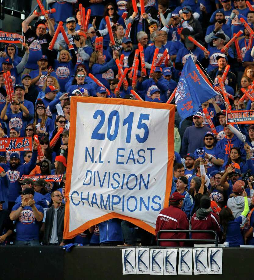 New York Mets fans celebrate the Mets season with a banner in center field after the Mets concluded the regular season with a 1-0 shutout of the Washington Nationals in a baseball game in New York, Sunday, Oct. 4, 2015. (AP Photo/Kathy Willens) ORG XMIT: NYM125 Photo: Kathy Willens / AP