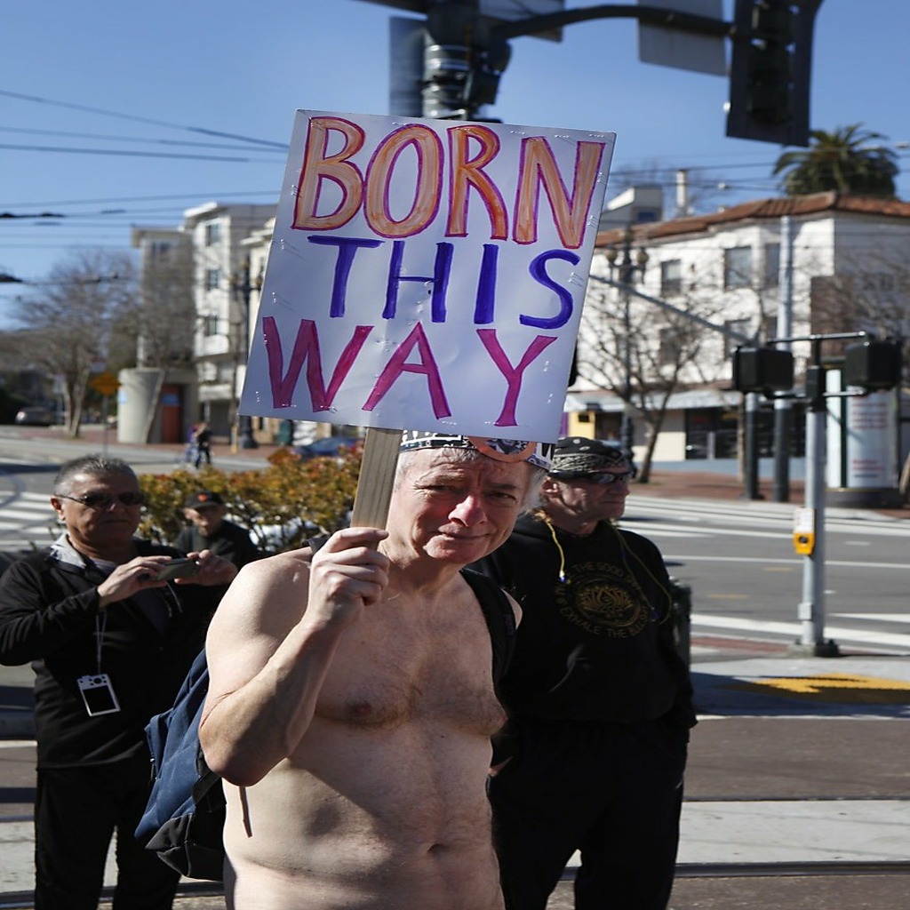 "Jim" holds a sign reading 'Born This Way' while walking in the first annual Valentine's Nude Parade put together by the Body Freedom Network, in San Francisco, Calif., on Saturday Feb. 13, 2016 Photo: Brittany Murphy, The Chronicle