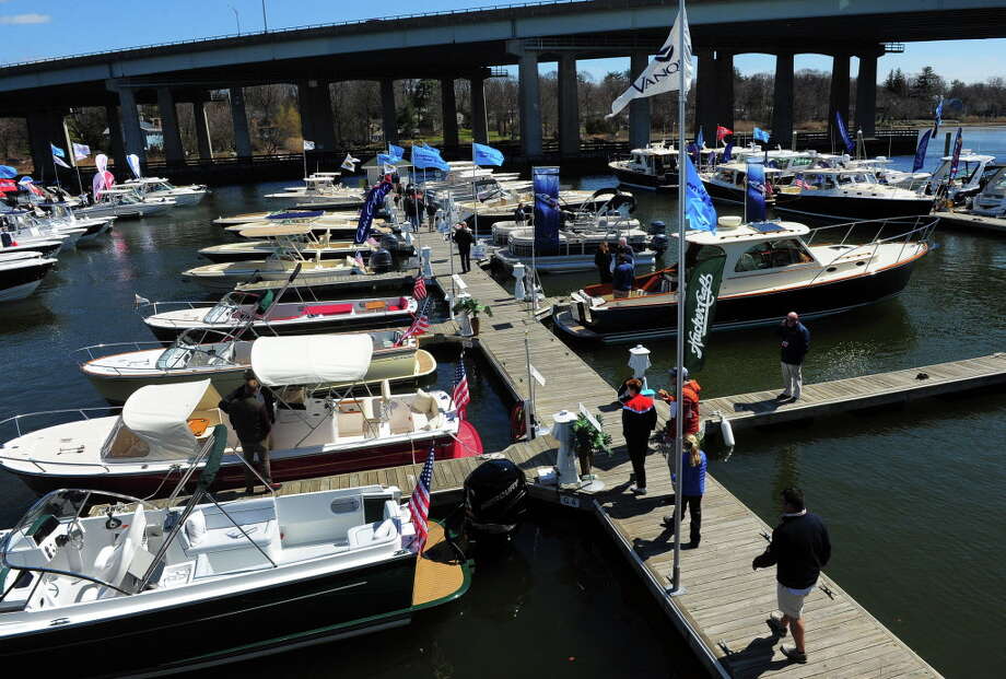 Area residents gather to check out some of the boats for sale at the annual Greenwich Boat Show at the Greenwich Water Club in Greenwich, on Apr. 11, 2015. Photo: Christian Abraham / Christian Abraham / Greenwich Time