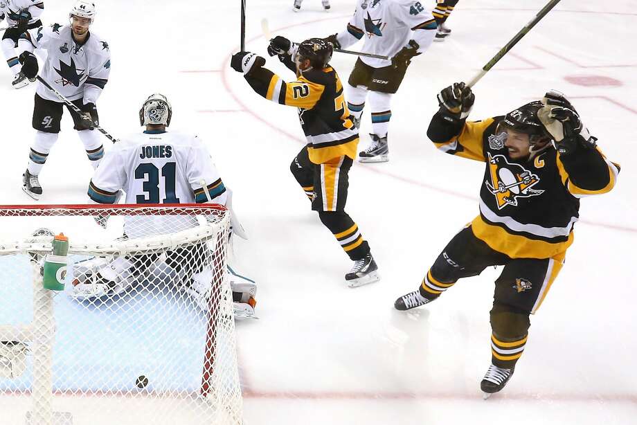 The Penguins’ Patric Hornqvist (center) and Sidney Crosby (right) celebrate Conor Sheary’s game-winner in overtime. Photo: Bruce Bennett, Getty Images