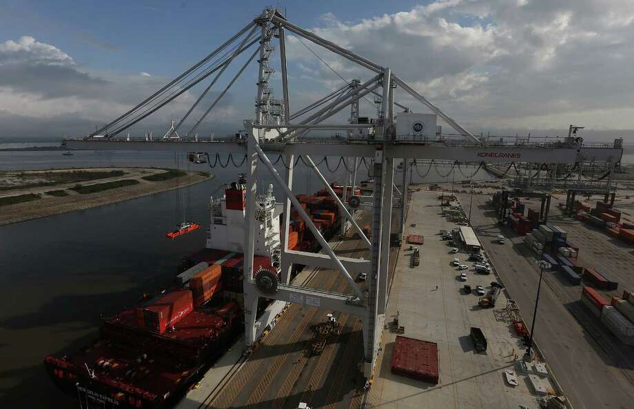 The new super post-Panamax cranes operates at the Houston port on Friday, Nov. 6, 2015, in LaPorte. The larger renovation to the terminal is to handle increases in container trade, and in anticipation of larger ships coming through the Panama Canal after it completes its expansion next year. ( Elizabeth Conley / Houston Chronicle ) Photo: Elizabeth Conley, Staff / © 2015 Houston Chronicle