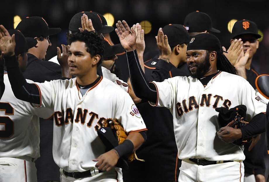 SAN FRANCISCO, CA - JULY 06:  Johnny Cueto #47 of the San Francisco Giants (R) and his teammates celebrates defeating the Colorado Rockies 5-1 at AT&T Park on July 6, 2016 in San Francisco, California.  (Photo by Thearon W. Henderson/Getty Images) Photo: Thearon W. Henderson, Getty Images