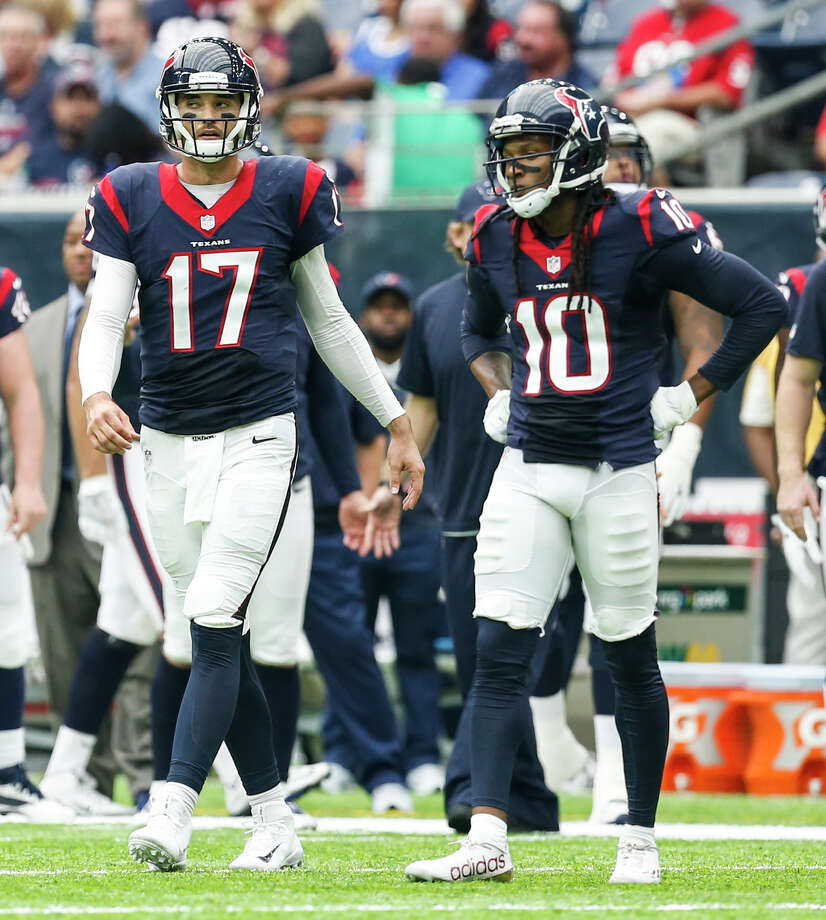 Houston Texans quarterback Brock Osweiler (17) and wide receiver DeAndre Hopkins (10) walk onto the field during the second quarter of an NFL football game against the Tennessee Titans at NRG Stadium on Sunday, Oct. 2, 2016, in Houston. ( Brett Coomer / Houston Chronicle ) Photo: Brett Coomer, Staff / u00a9 2016 Houston Chronicle