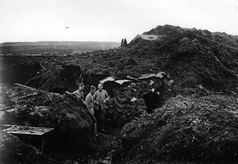 World War I soldiers in a trench at Verdun. The British wanted to overcome the stalemate of trench warfare through the introduction of an armored vehicle powered by an internal combustion engine. Photo: Topical Press Agency/Getty Images