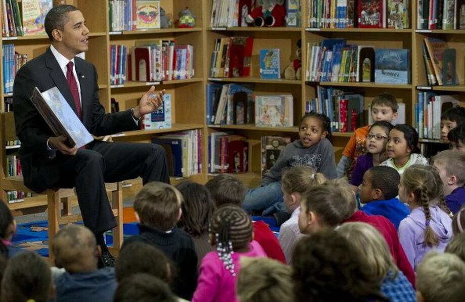 President Obama reads “
’Twas the Night Before Christmas” to students at Long Branch Elementary School in Arlington, Va., in December 2010. Photo: Saul Loeb / AFP / Getty Images