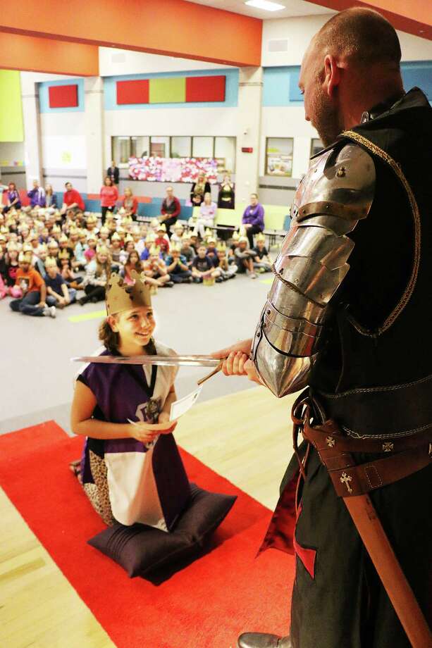 Fifth-grader Kadence Carroll at E. R. Richter Elementary is knighted into the Order of the Black Prince by Sir James Lehman, KTJ. The moving ceremony focused on studentsÂ accomplishing the character trait of Discipline, the first among many in the program that will be taught the students. Photo: David Taylor
