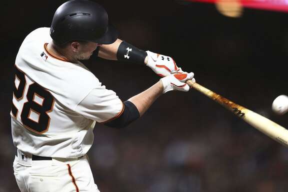 Buster Posey connects for a home run against the Dodgers on Monday night, one of six he’s hit this month.