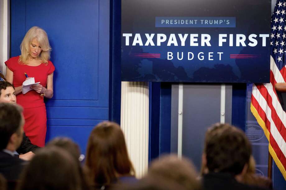 Counselor to the President Kellyanne Conway listens as Budget Director Mick Mulvaney speak to the media about President Donald Trump’s proposed fiscal 2018 federal budget. It is not a “taxpayers first” budget. It is a target-on-poor-Americans budget. Photo: Andrew Harnik /Associated Press / AP